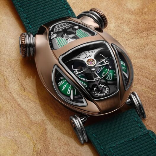 Bulgari x MB&F Serpenti 2025 watch in rose gold with green domes, featuring a sinuous case design and visible flying balance wheel.
